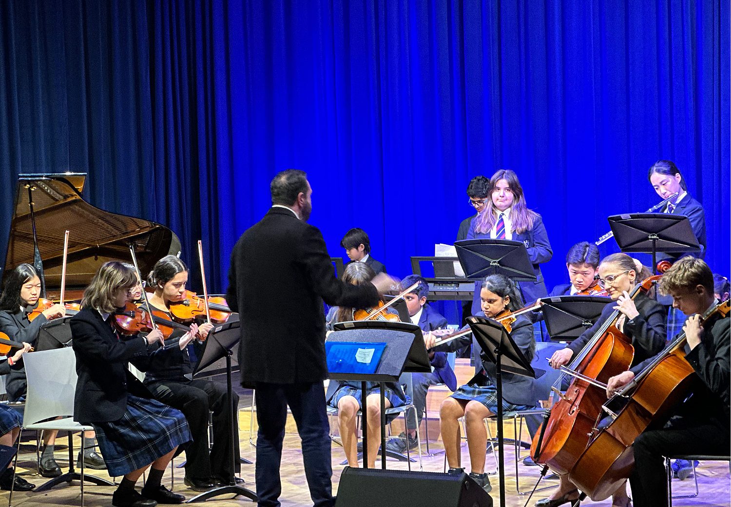 Pupils performing at a school orchestra concert