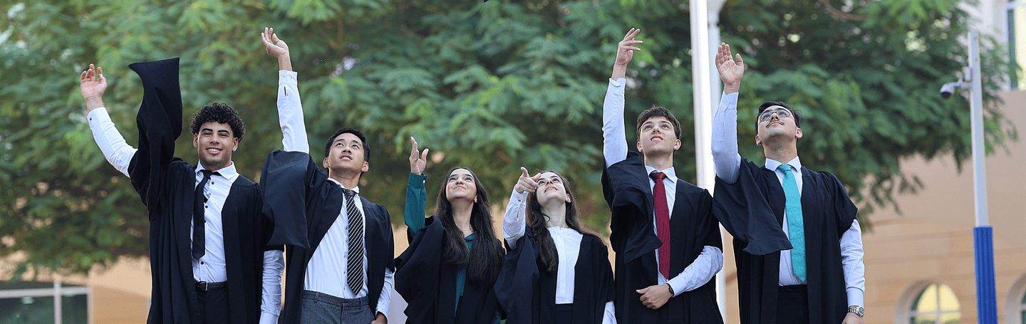 Graduating Sixth Formers throwing their caps at Brighton College Abu Dhabi