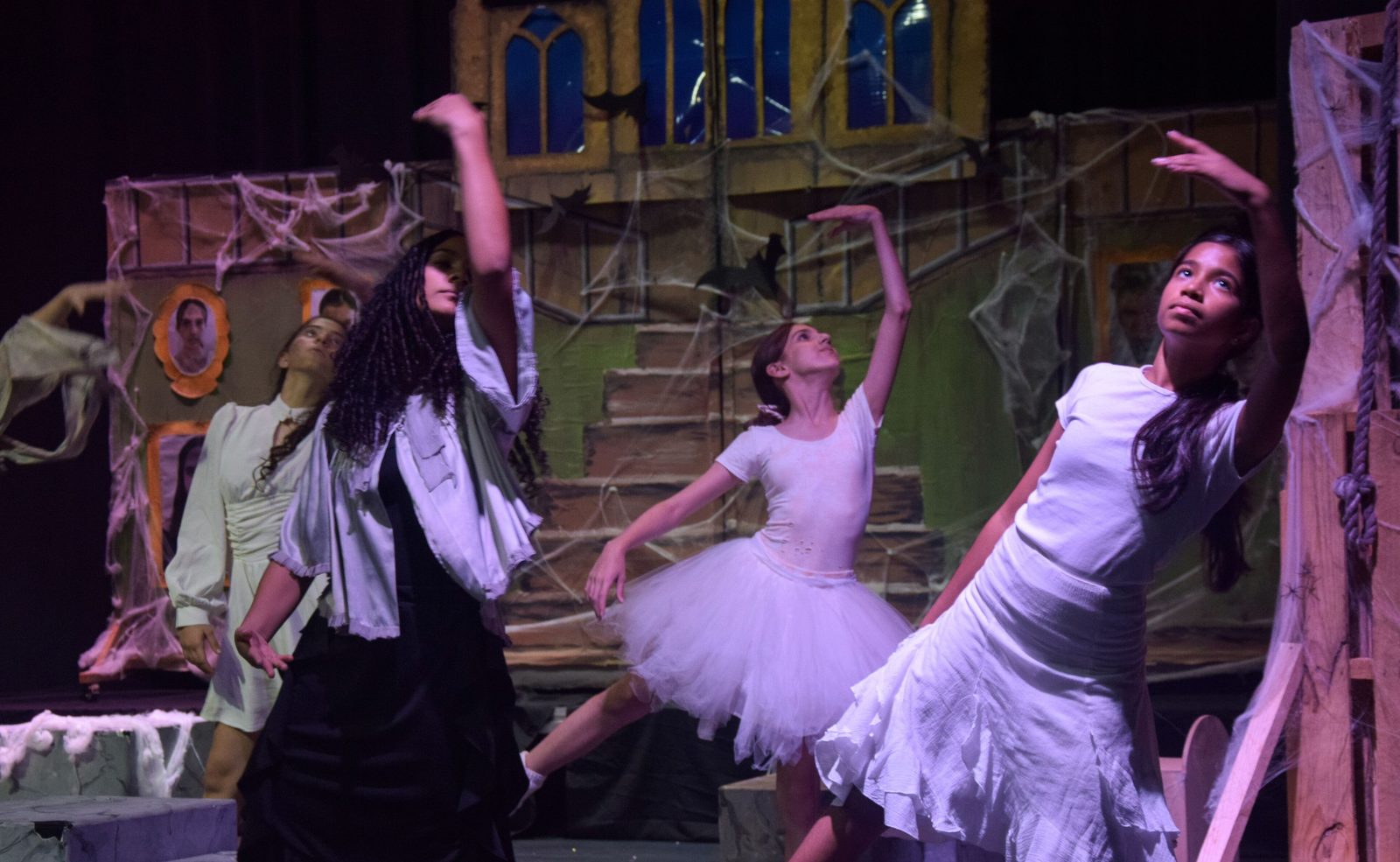 Pupils performing in a school stage production