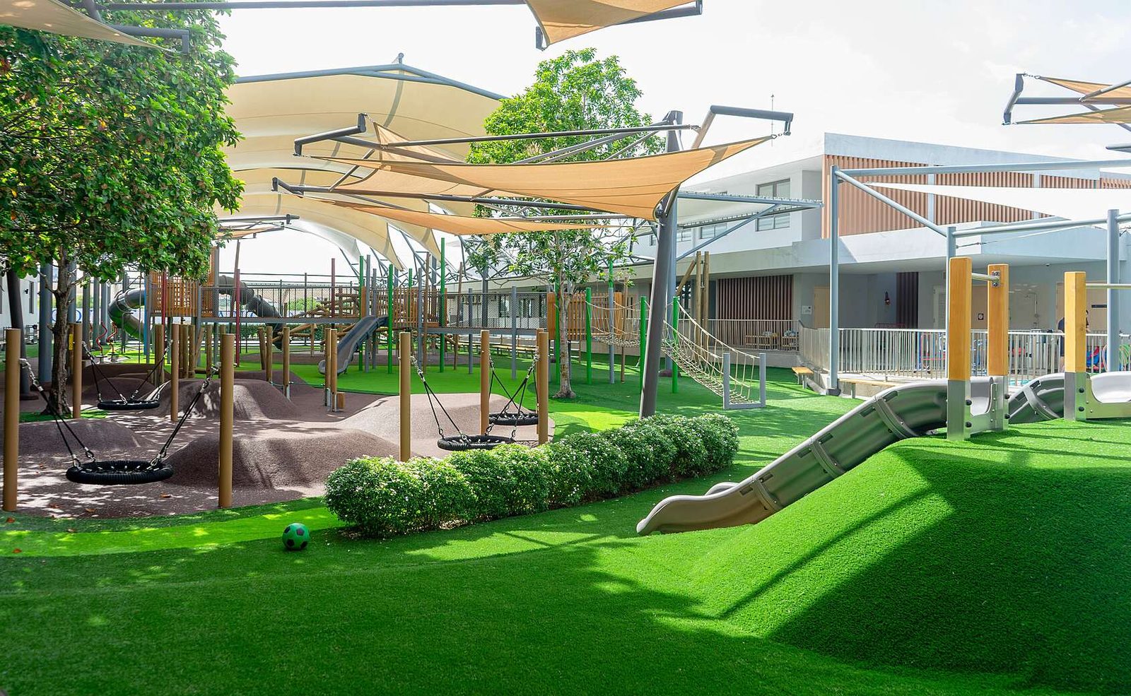 Covered Prep School playground with swings and slides