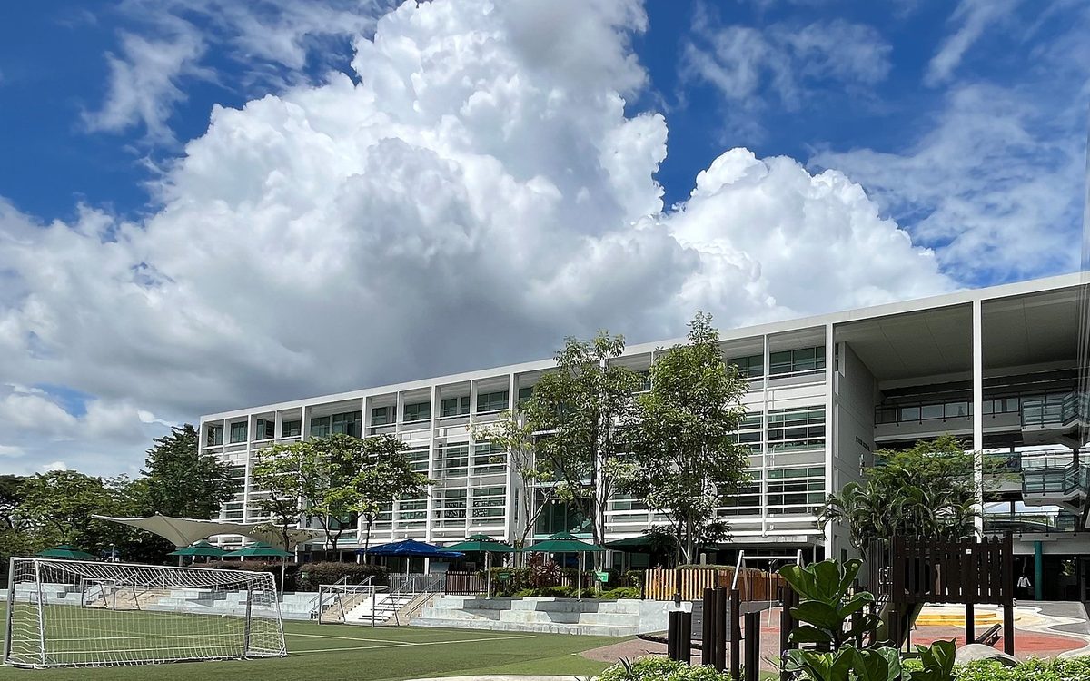Teaching block and sports pitch at Brighton College (Singapore)