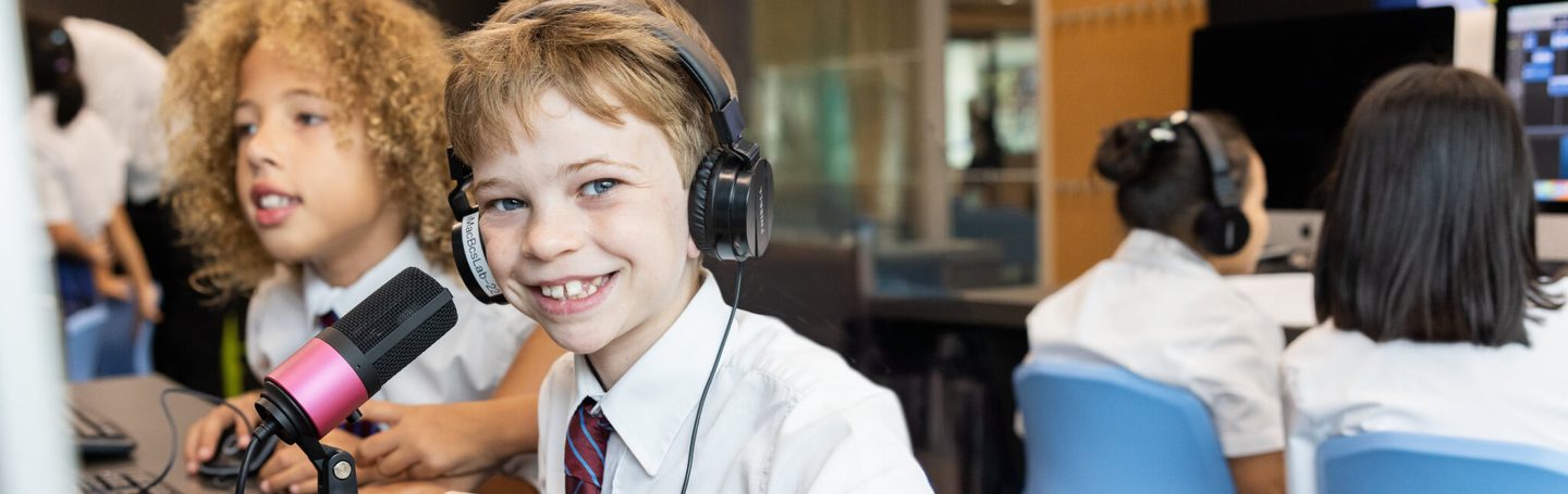Prep pupils recording a podcast in class