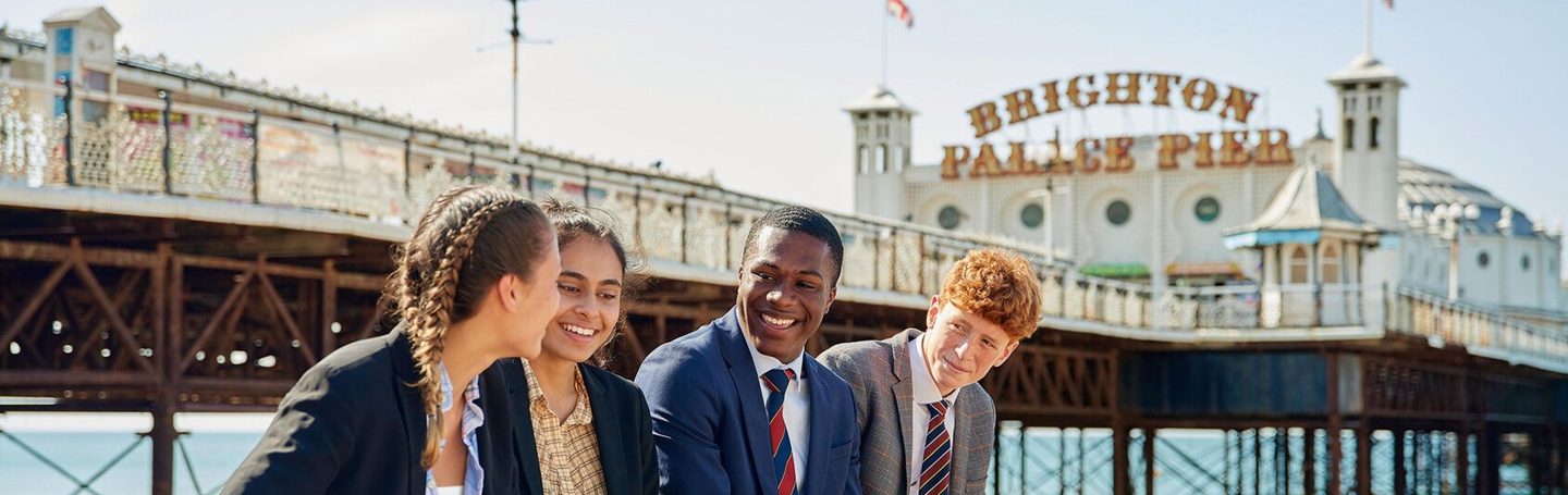 Brighton College pupils on the seafront by Brighton Palace Pier